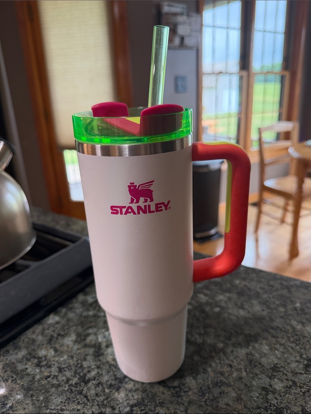 Stanley White Travel Tumbler with Green Lid and Red Handle
